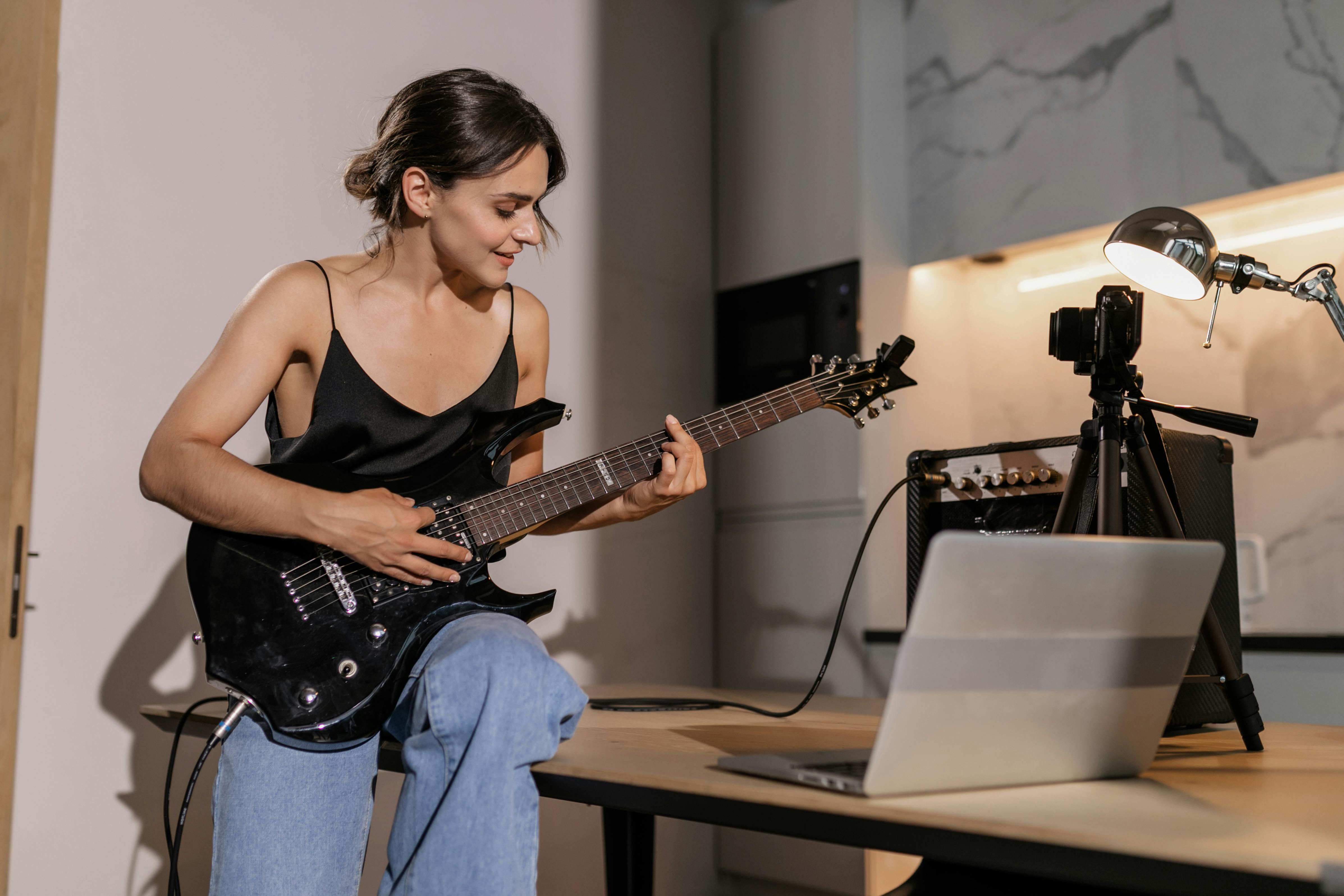 Beginner playing easy guitar riffs